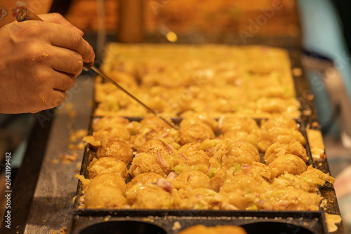 Bild auf Leinwand Street stall making takoyaki on site