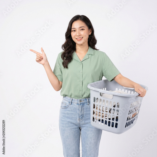 Happy Asian Woman with Laundry Basket After Finishing Housework on White Background