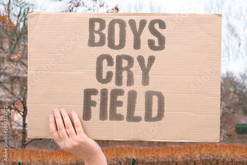 Foto "Boys cry field" Male child weeps during sports