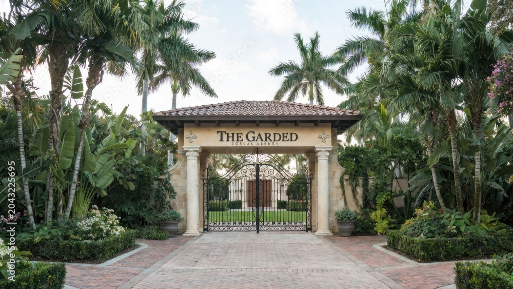 Fototapeta premium Elegant entrance to the garde coral gables miami - serene garden gateway scenic daylight view