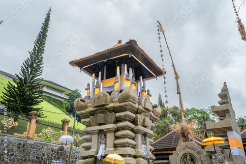 Indonesian statue in a temple with offerings