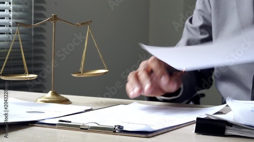 Male legal consultant signing contract papers 