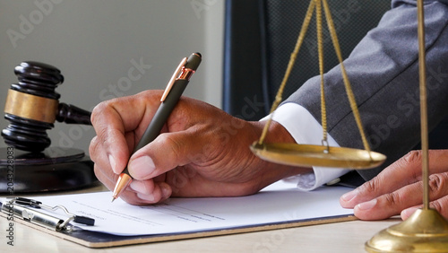 Canvastavla Hand holds pen, poised to sign legal document