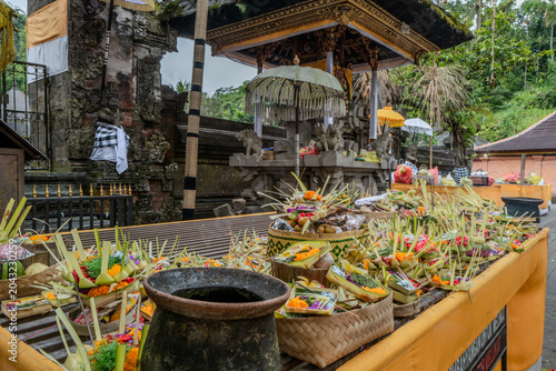 Indonesian statue in a temple with offerings