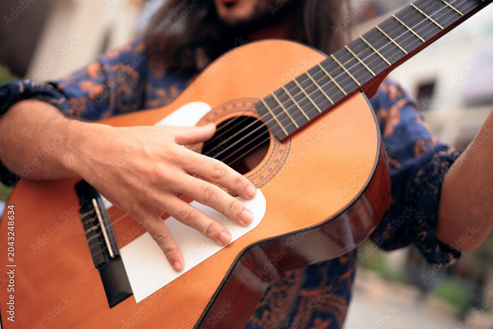 Fototapeta premium Hands Playing Flamenco Guitar During Andalusian Music Performance