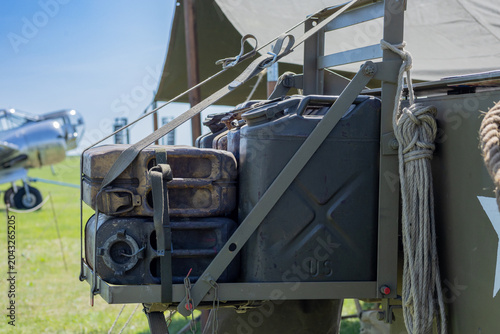 Vintage fuel container storage mounted on historic military transport vehicle