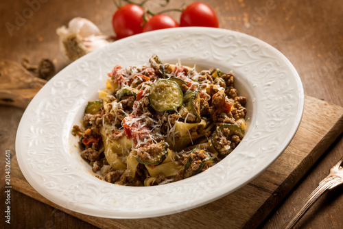 Tagliatelle with white ragout zucchinis and tomatoes