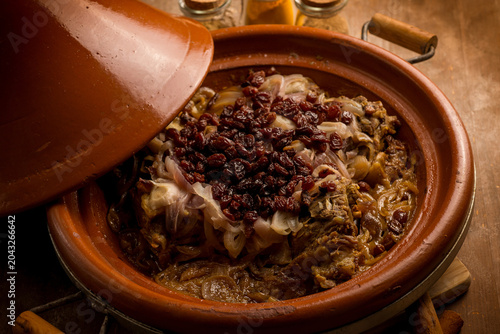 traditional moroccan lamb tajine with onions and dried grapes