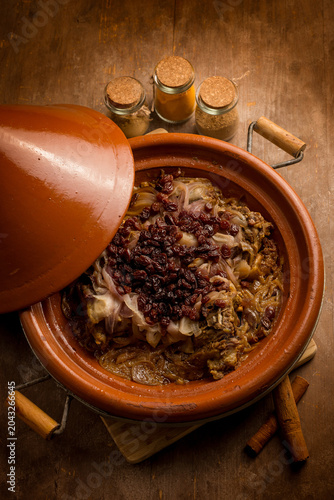traditional moroccan lamb tajine with onions and dried grapes