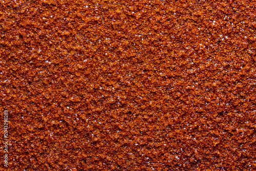 Foto Red sandpaper texture closeup background