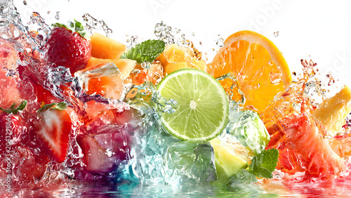 Vibrant Fresh Fruits Including Strawberries Lime and Orange Splashing in Water with Ice Cubes and Mint Leaves on White Background, Colorful Summer Beverage Concept High-Speed Shot