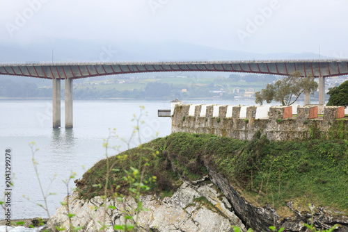 Antique San Damian Fortress and The Colossal Los Santos bridge over The Eo estuary in Ribadeo town