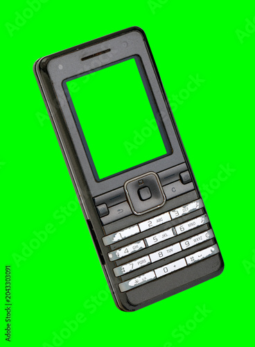  A classic mobile phone from the early 2000s with a green screen, on a green background.