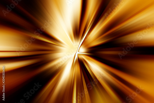 Abstract radial zoom blur in gold, brown, yellow and white tones, forming dynamic glowing light rays radiating outward with strong motion and depth.