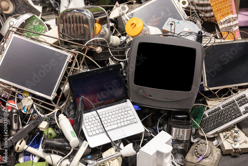 Pile Of Discarded Electronic Waste Including Laptop Television Keyboard And Other Obsolete Devices For Recycling And Environmental Concepts