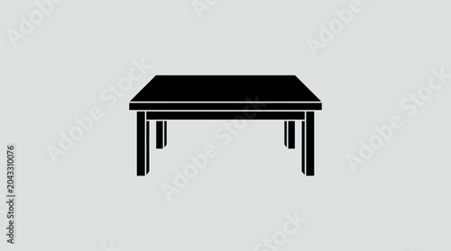 Simple Black Table Isolated on a Plain Gray Background.