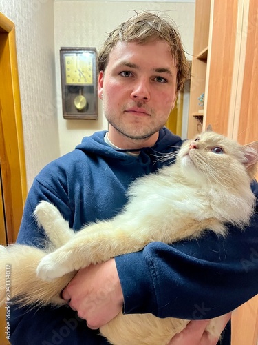 young man with cat