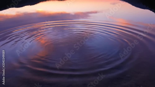 Sunset Reflection Ripples on Water Surface