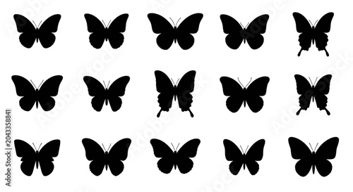 Set of silhouettes of butterflies in various poses, showcasing the diversity of these beautiful insects in flight