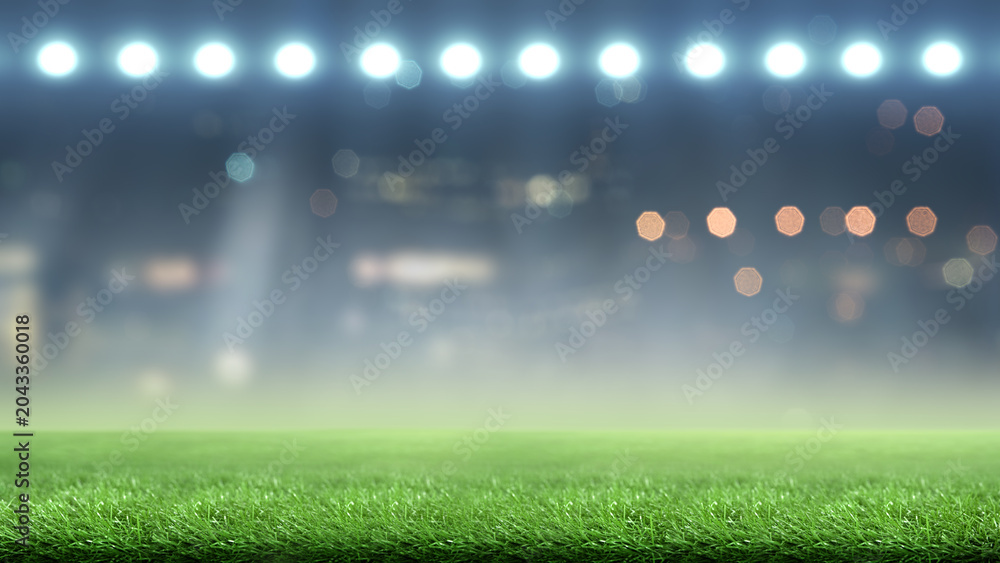 Naklejka premium Blurred stadium background with bright floodlights shining on green grass turf at night