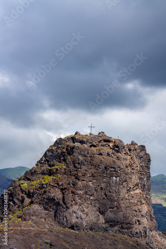 Small Mountain Peak with a Christian Cross in Agaete, Gran Canaria, Spain