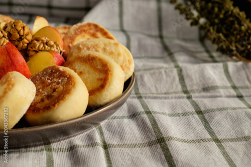 Delicious Ukrainian cottage cheese pancakes served with fresh fruit