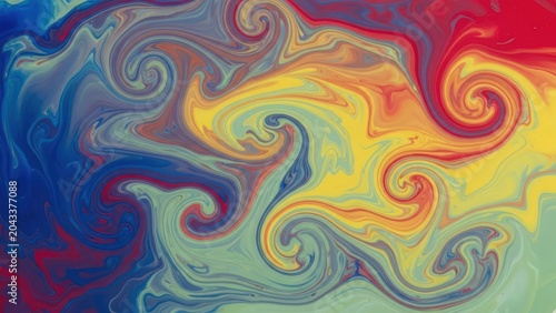 Abstract swirls of vibrant mixed paint colors in fluid motion