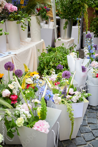 Stalls with flowers and bouquets at local street market