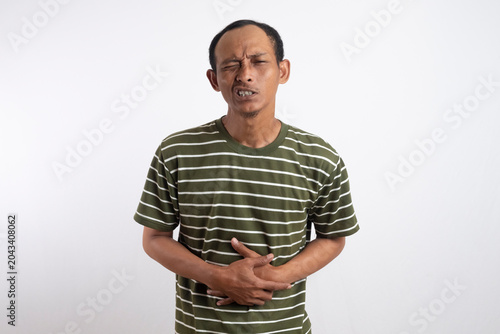 Obraz na plátně Face expresses torment acute pain in stomach, colic in abdomen