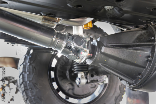 SUV car drive shaft with universal joint to differential.