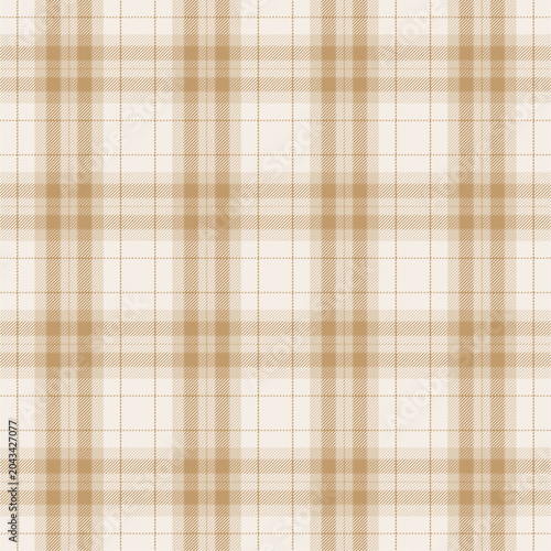 Seamless plaid pattern in golden mustard, tan, white, camel, beige, and ivory colors. 