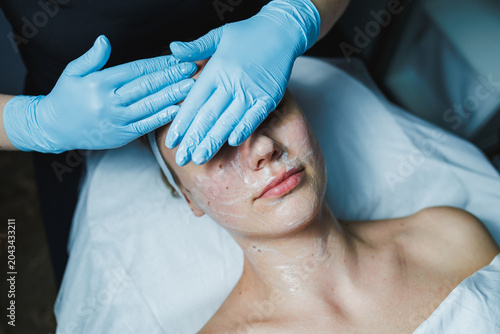 Εκτύπωση καμβά Cosmetology appointment for a woman receiving a facial treatment at a spa during