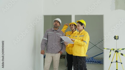 Construction Site Engineer Worker Helmet Inspection Plan Teamwork Interior Renovation Meeting for Building Review in Room