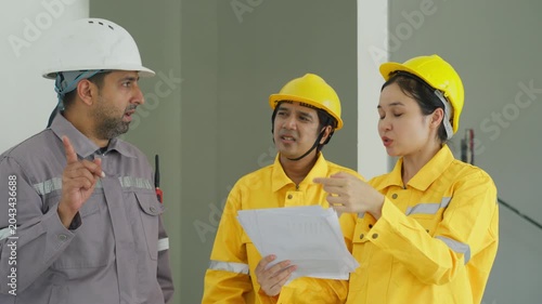 Industrial worker safety helmet team engineer planning paper site construction meeting inspection group discussion document uniform protective workplace SEO title