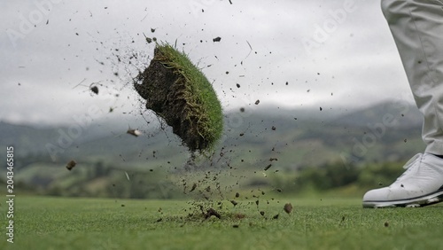 midair. Torn turf spinning in air with misty hills in background. travel magazines, destination branding, wall prints, designed for travel destination branding, used by researchers.