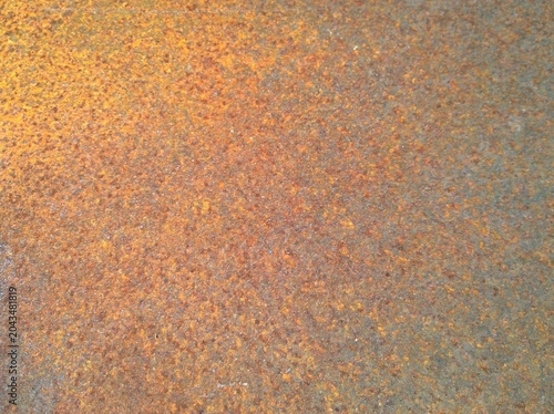 Corroded Metal Surface with Orange Rusty Texture Background