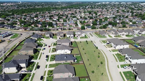 Broad neighborhood grid near Cottle Dr in Arlington, Texas shows long rows of homes and wide park space shaping community layout. Repeating roofs, bright lawns, master planned suburban subdivision