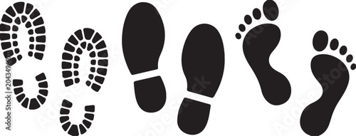 Black footprints and shoe prints on white background