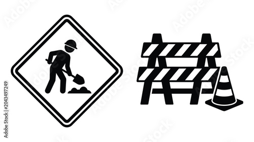 road construction sign and barrier silhouette worker