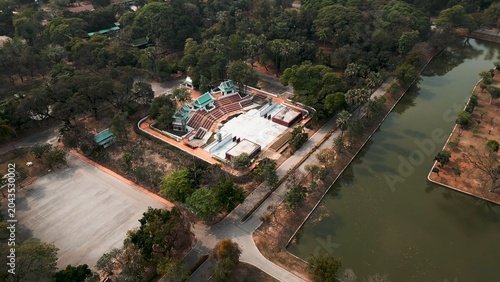 Bild auf Leinwand Sukhothai's cultural amphitheater in green park with serene canal