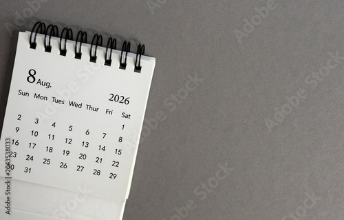 Hello August, desk calendar for planning for August 2026 on a gray background