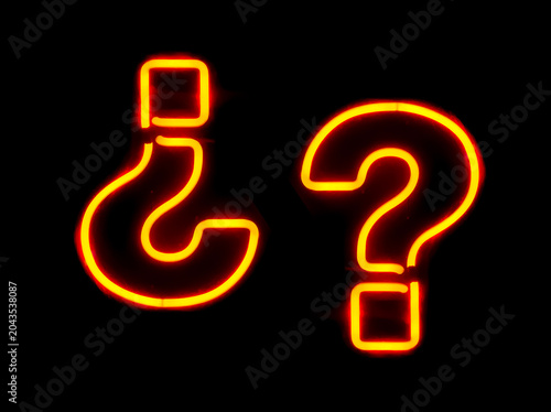 Glowing orange and yellow neon signs shaped like upright and inverted question marks isolated on a solid black background, symbolizing curiosity, interrogation and confusion.