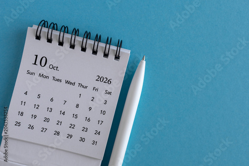 Hello October desk calendar for planning for August 2026 on a blue background