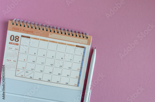 Hello August, desk calendar for planning for August 2026 on a pink background