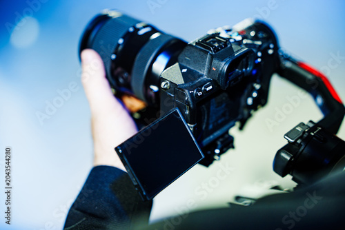 Videographer filming with gimbal stabilizer