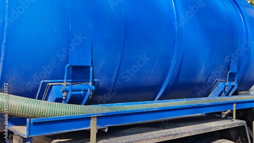 Sewage tanker. Sewage pumping truck on the street.