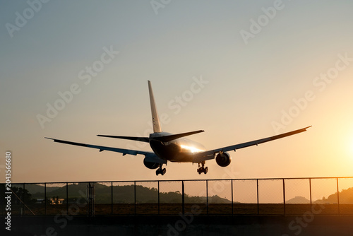 фотографія A wide-body airliner approaches an airport runway for landing