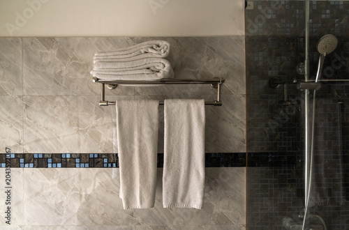 Old, washed hotel towels in bathroom