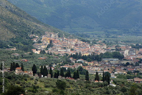 Panoramic view of Venafro, a historic town nestled on a hillside surrounded by olive groves and mountains in Molise, Italy