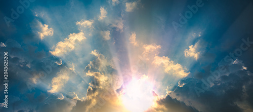 Photography space place supernova Beautiful sunlight streaming through dramatic clouds, creating crepuscular rays in a blue sky